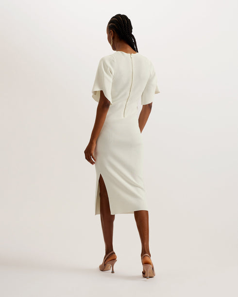 RAELEA-Dresses-The RAELEA midi dress is made to flatter with a soft ribbed knit material and sculpting bodycon fit that shows off your shape. The short, fluted sleeves and split hem add a level of understated glamour that will make this dress your go to for special occasions. Finish your look with a pair of heels and get ready to feel your most beautiful self. Midi dress Sculpting bodycon fit Ribbed knit Short fluted sleeves Side split hem Neckline stitch details Exposed zip fastening Crew neck Lydia is 5'1
